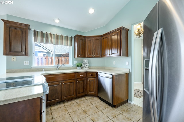 kitchen featuring appliances with stainless steel finishes, sink, and light tile patterned floors