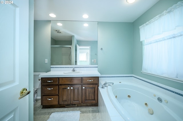 full bathroom with shower with separate bathtub, tile patterned floors, vanity, and toilet