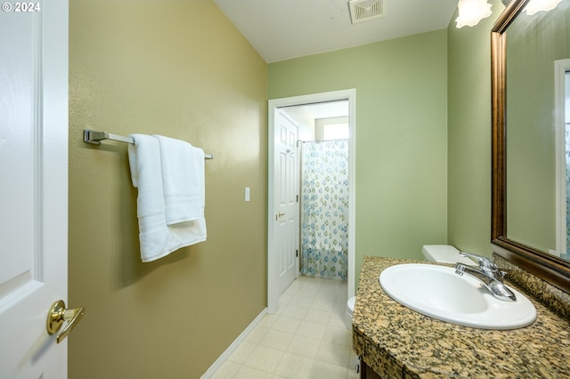 bathroom featuring vanity, toilet, and a shower with shower curtain