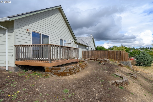 view of side of property featuring a deck