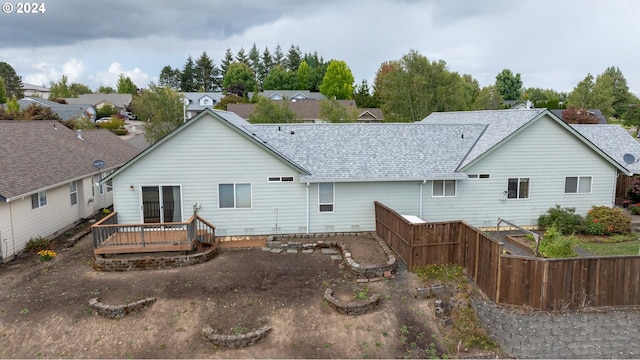 rear view of property with a wooden deck