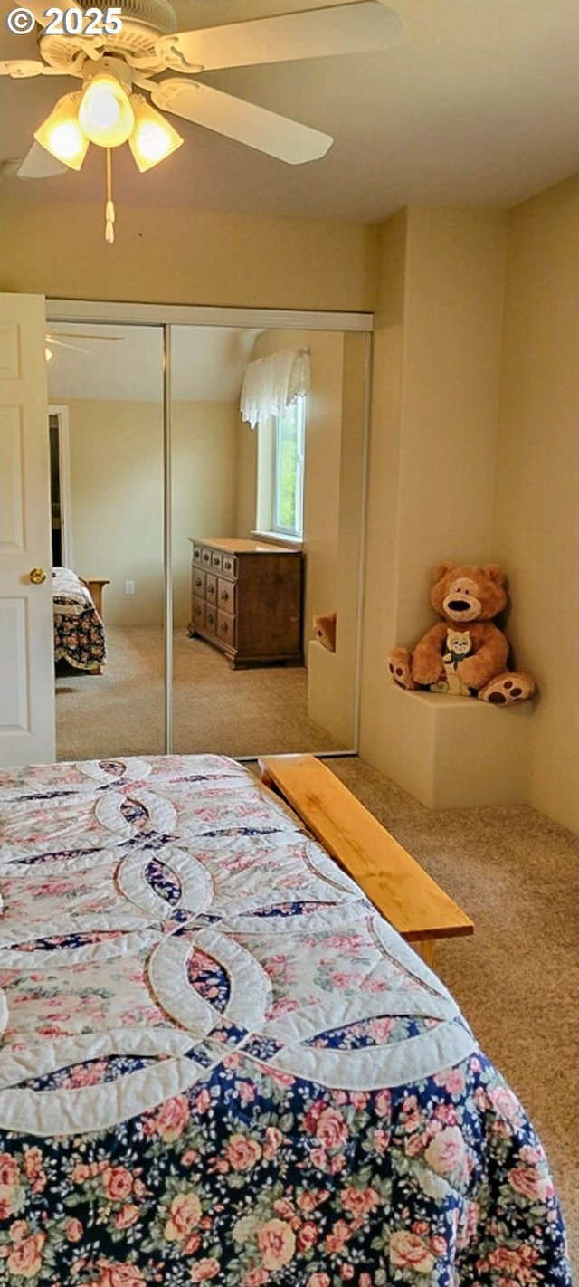 carpeted bedroom featuring a ceiling fan