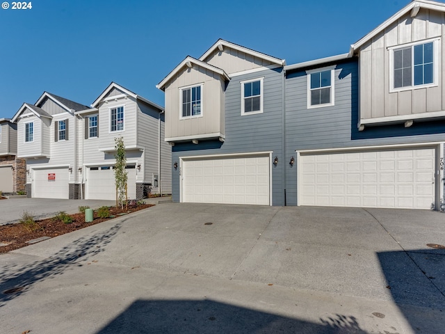 townhome / multi-family property featuring a garage