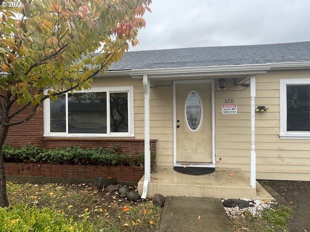 170 NE Exchange Ave, Roseburg, OR 97470 - doorway to property featuring roof with shingles