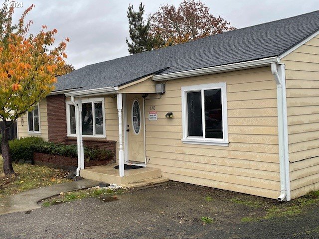170 NE Exchange Ave, Roseburg, OR 97470 - view of front of home with a shingled roof