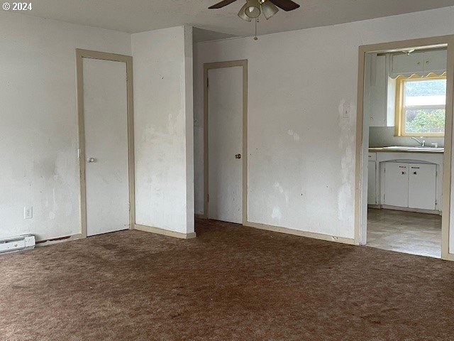 170 NE Exchange Ave, Roseburg, OR 97470 - unfurnished bedroom featuring carpet and ensuite bathroom