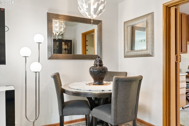 dining room with a notable chandelier