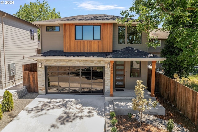 view of front of property with a garage and a porch