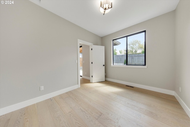 unfurnished room featuring light wood-type flooring