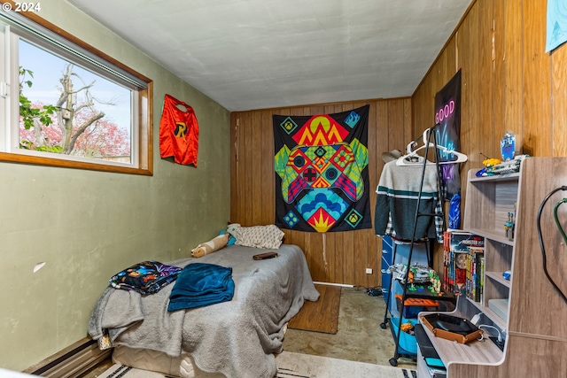 bedroom with wood walls