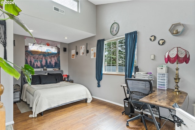 bedroom featuring wood-type flooring