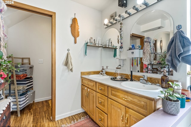 bathroom featuring hardwood / wood-style flooring and vanity