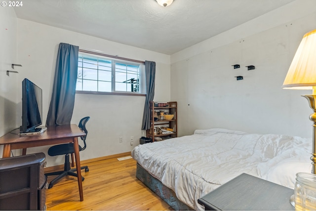 bedroom with light hardwood / wood-style flooring