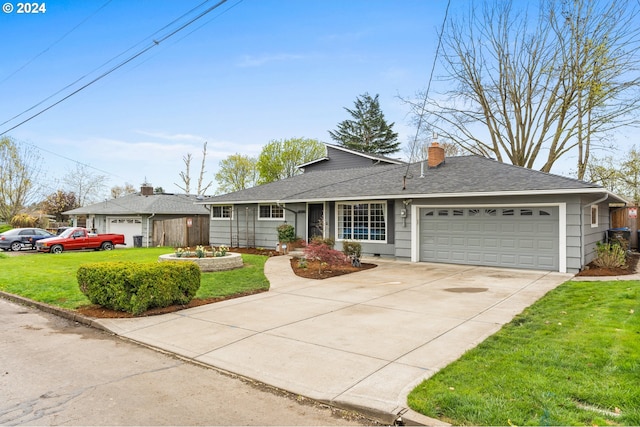 ranch-style home featuring a garage and a front yard