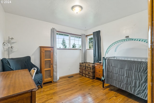 bedroom featuring hardwood / wood-style flooring