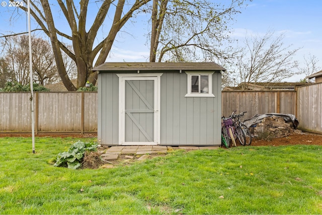 view of outbuilding with a lawn