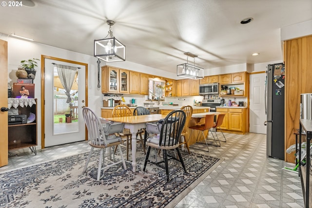 dining area with an inviting chandelier