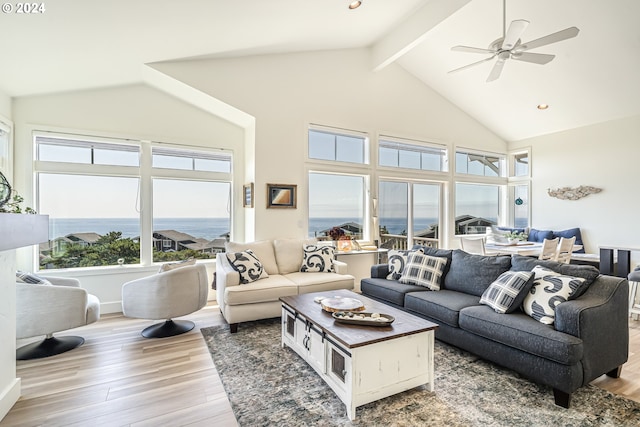 living room with hardwood / wood-style flooring, ceiling fan, high vaulted ceiling, and beam ceiling