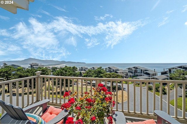 balcony with a water and mountain view