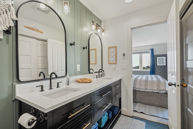 bathroom with tile patterned flooring and vanity