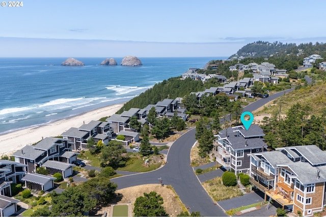 aerial view featuring a water view and a view of the beach