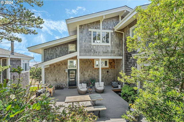 rear view of property with a deck