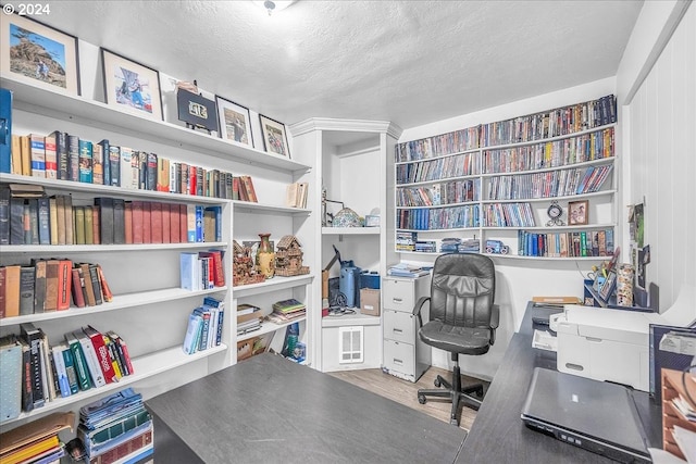 office space featuring dark wood-type flooring and a textured ceiling