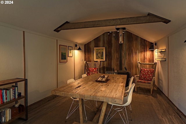 dining area featuring dark wood-type flooring, wood walls, and vaulted ceiling