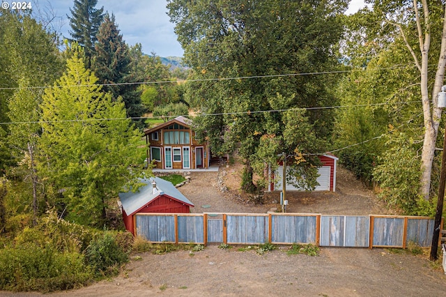 exterior space featuring an outbuilding and a garage