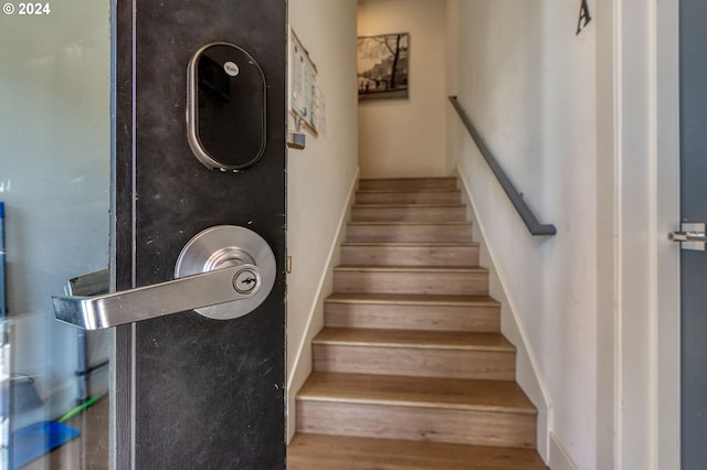 stairway featuring hardwood / wood-style floors