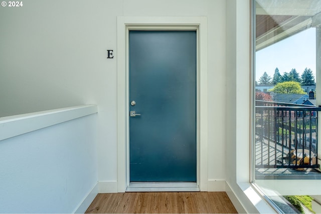 entrance to property with a balcony