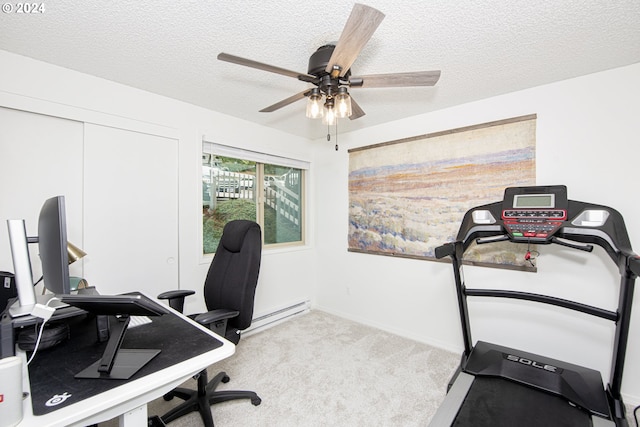 office space featuring ceiling fan, light colored carpet, baseboard heating, and a textured ceiling