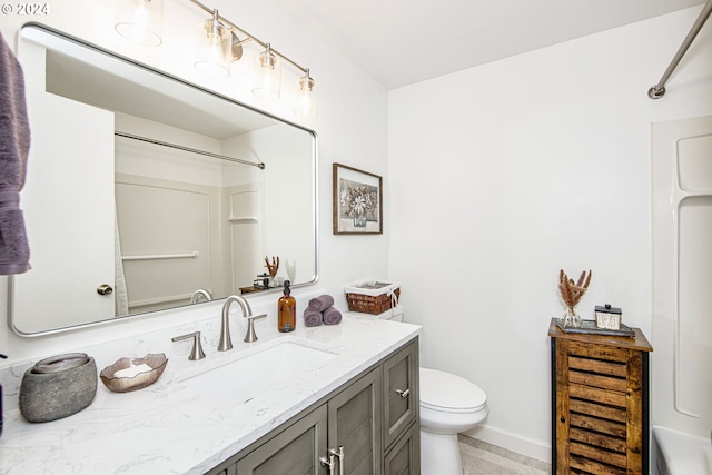 bathroom with toilet and vanity