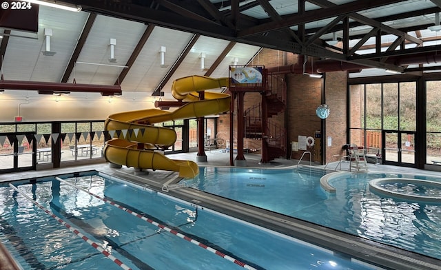 view of pool featuring a jacuzzi and a water slide