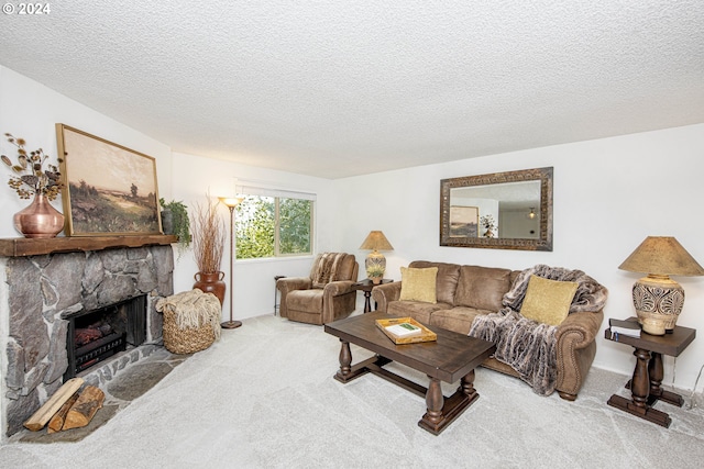 living room with a textured ceiling, a fireplace, and carpet flooring