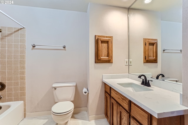 full bathroom with vanity, tiled shower / bath combo, and toilet