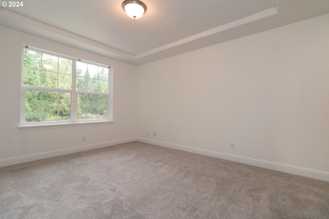 9 Waterford Downs, Florence, OR 97439 - carpeted spare room with a tray ceiling and baseboards