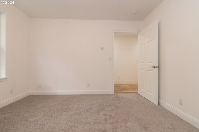 9 Waterford Downs, Florence, OR 97439 - empty room featuring baseboards and light carpet