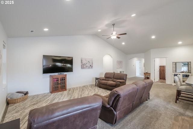 living room with lofted ceiling, light carpet, and ceiling fan