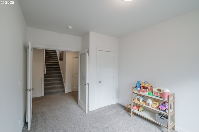 playroom featuring light colored carpet