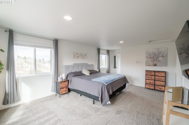 bedroom with light colored carpet