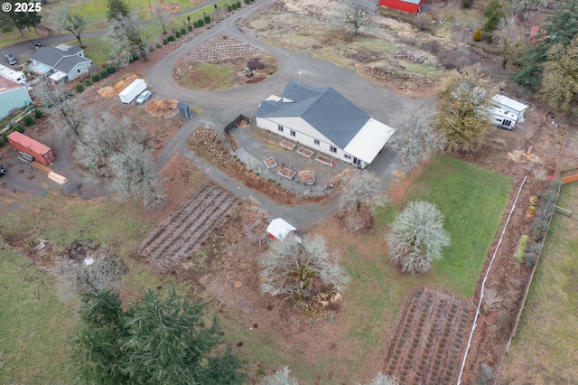 birds eye view of property featuring a rural view