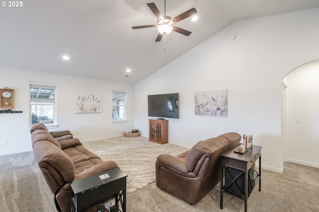 living room featuring ceiling fan, light colored carpet, and high vaulted ceiling