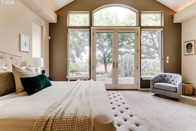 carpeted bedroom featuring access to outside, french doors, and high vaulted ceiling