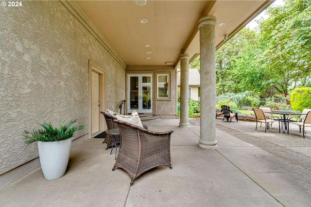 view of patio with french doors and outdoor dining area