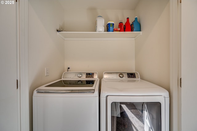 laundry room with independent washer and dryer