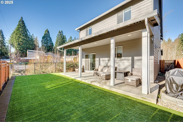 back of property featuring a lawn and a patio