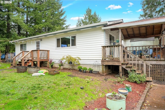 rear view of property with a lawn