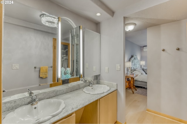 bathroom with hardwood / wood-style floors and vanity