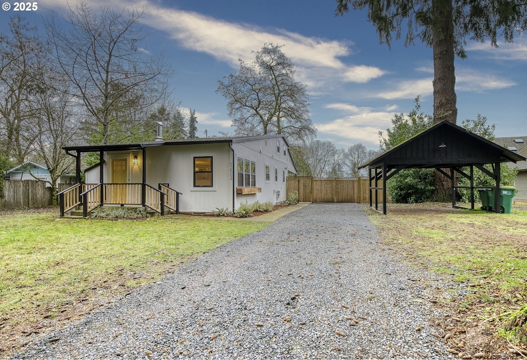 view of side of home featuring a lawn